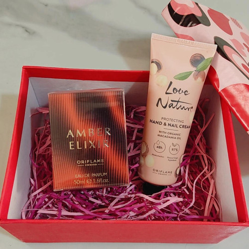 پیشپک نارنجی عطر امبرالکسیرو کرم دست و ناخن اوریفلیم(عطر زنانه و کرم ماکادمیا)